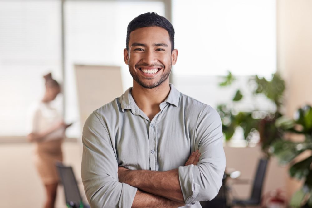Smiling man with bright, healthy teeth, representing confidence after cosmetic or restorative dental care