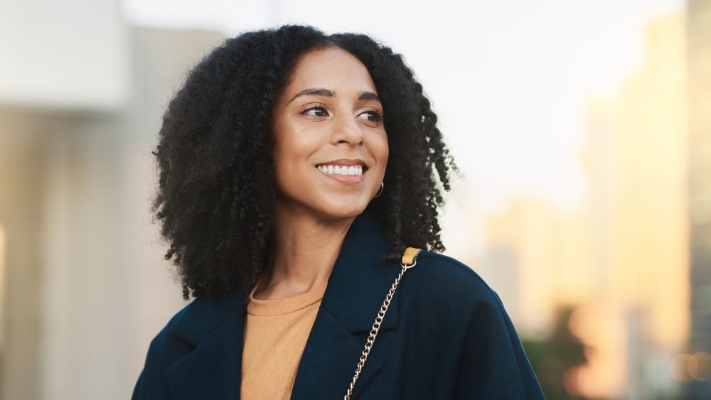 Service page content image 9 Smiling woman with bright, healthy teeth, representing confidence after cosmetic dental care