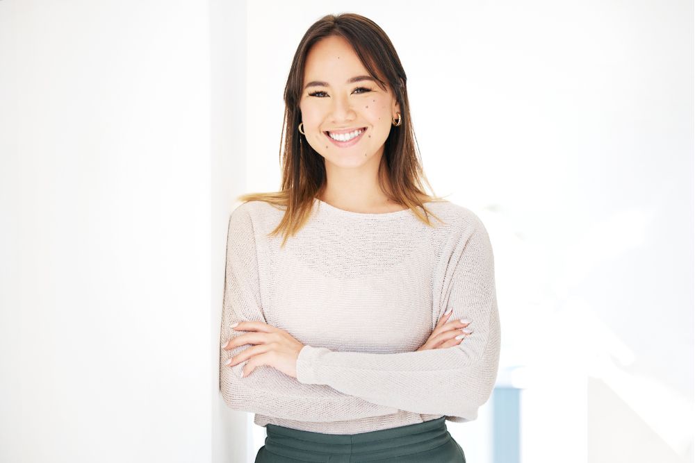 Smiling woman with bright, healthy teeth, representing confidence after cosmetic dental care