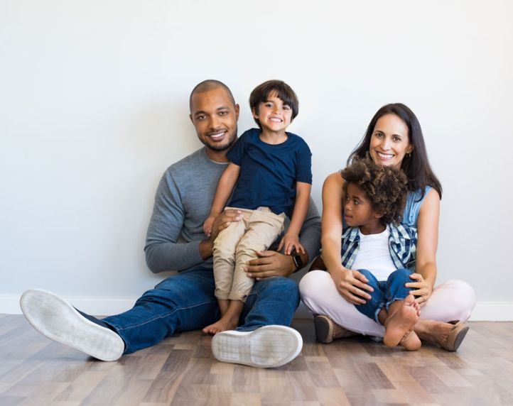 Smiling family with children, representing friendly, comprehensive family dental care for all ages